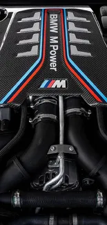 Detailed view of a BMW engine showcasing carbon fiber and sleek design.