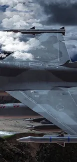 Fighter jet flying through dramatic cloudy sky background.