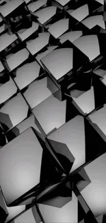 Geometric pattern of sleek black cubes.