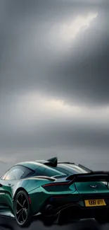 Sleek green sports car under gray stormy sky.