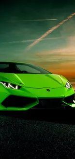 Sleek green sports car at sunset wallpaper.