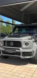 Sleek grey luxury SUV parked in a modern garage.