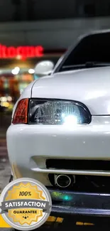 Sleek Honda car with glossy headlights in a night setting.