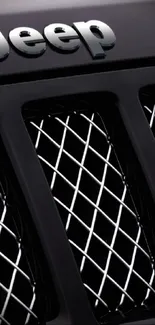 Sleek Jeep grille wallpaper in black with chrome accents.