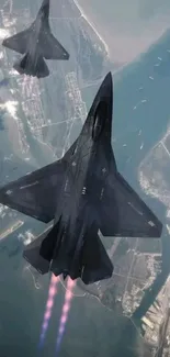 Fighter jets soaring over coastline in dynamic aerial view.