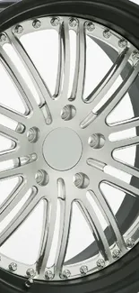 Sleek metallic car wheel with elegant design.