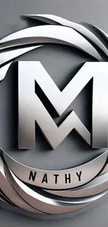 Sleek metallic M logo wallpaper with gray tones.