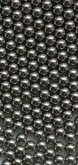 Glossy metallic spheres in a sleek design for mobile wallpaper.