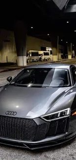 Sleek metallic sports car in urban street setting.