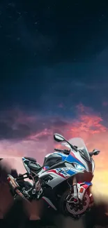 Motorcycle at sunset with vibrant sky.