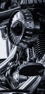 Close-up of a sleek motorcycle engine in black and chrome tones.