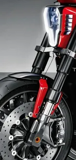 Close-up of a sleek red motorcycle front wheel interface.