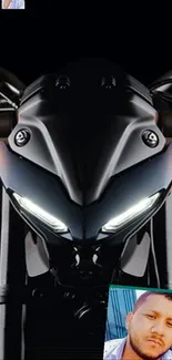 Sleek motorcycle front with glowing headlights.