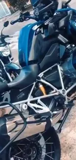 Sleek blue motorcycle parked outdoors, showcasing modern design.