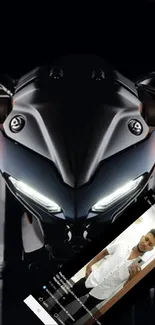 Sleek motorcycle at night with bright headlights.