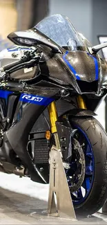 A sleek, modern motorcycle on display in a showroom with blue highlights.