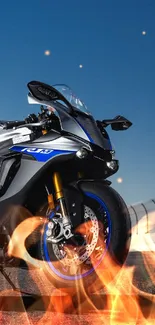 Sleek motorcycle on track with clear blue sky backdrop.