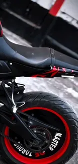 Close-up of a motorcycle tire with red accents.