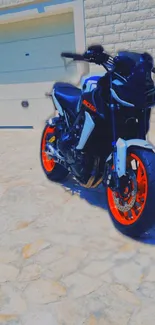 Sleek motorcycle with orange wheels on stone background.