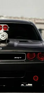 Black SRT muscle car with red details in stunning wallpaper.