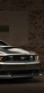 Sleek metallic Mustang car against rustic urban backdrop.