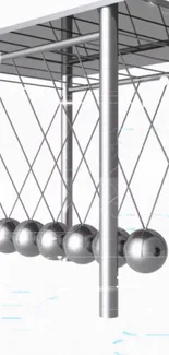 Sleek design of a Newton's Cradle art piece.