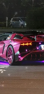 Pink sports car in neon-lit urban street at night.