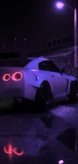 Nighttime car with neon reflections on street