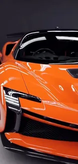 Sleek orange sports car with shiny finish and modern design.