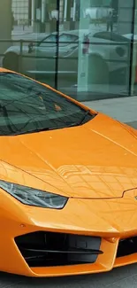 Orange sports car parked in urban setting.