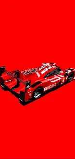 Red racing car on a vibrant background.