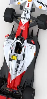 Top view of a sleek racing car in red and white.