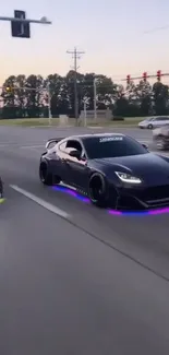 Stylish cars racing with neon lights at dusk.