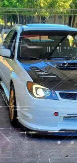 White and black rally car parked at a carwash, showcasing sporty design.