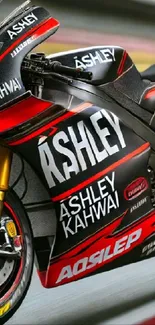 Close-up of a sleek red and black racing motorcycle side view.