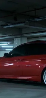 Sleek red sports car parked in an urban garage.