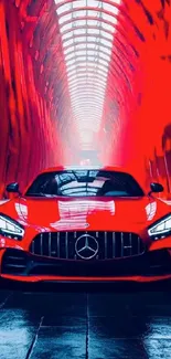 Sleek red sports car in a vibrant tunnel setting.