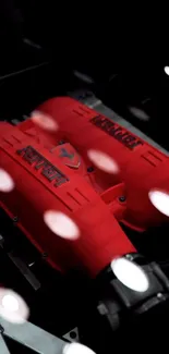 Red engine close-up with sleek design details.