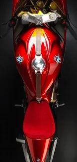 Top-down view of a sleek, red motorcycle with elegant design details.