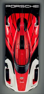 Top view of sleek, red sports car wallpaper for mobile.