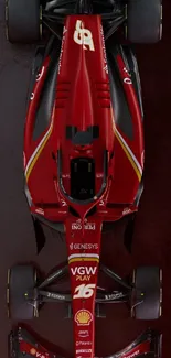 Vibrant red Formula 1 racing car viewed from above.