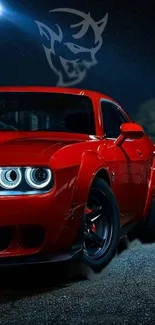 Vibrant red sports car with glowing headlights in a nighttime setting.