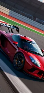 Vibrant red sports car speeding on a racing track in dynamic motion.