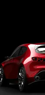 Red sports car with a sleek design on a dark background wallpaper.