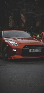 Sleek red sports car against a dark urban backdrop, capturing modern design.