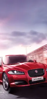 Red sports car in motion, exuding luxury and speed against a blurred background.