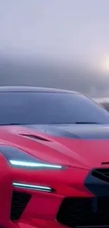 Red sports car with futuristic design in misty background.