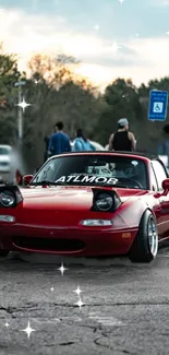 Red sports car with sparkling effects in an urban setting.