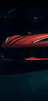 Red sports car on a dark background wallpaper.