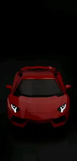 Sleek red sports car against a black backdrop.